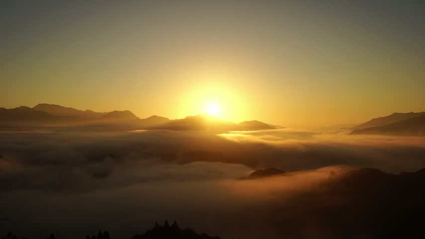 Golden sunrise and beautiful sea of clouds viewed from Kunimigaoka in Takachiho Miyazaki Japan