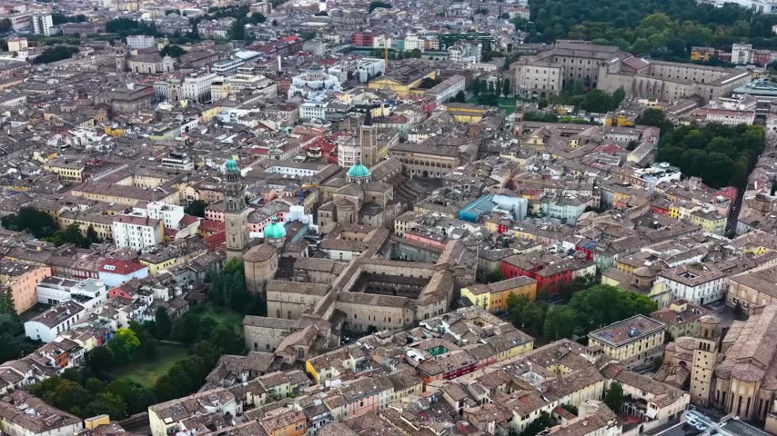 Aerial view above the old town of the city Parma in Italy, on a cloudy  day in summer.