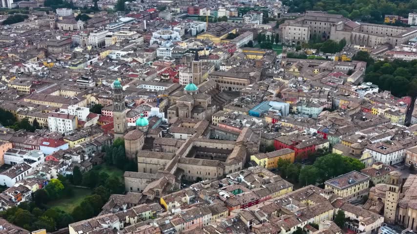 Aerial view above the old town of the city Parma in Italy, on a cloudy  day in summer.