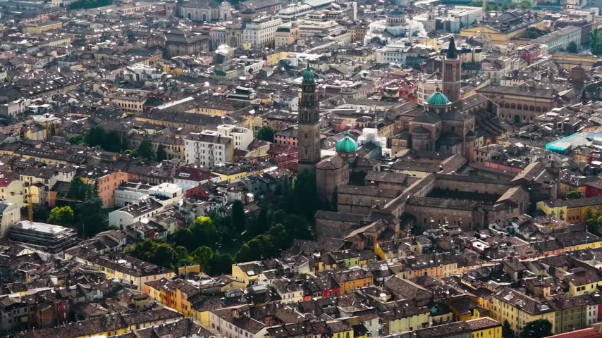 Aerial view above the old town of the city Parma in Italy, on a cloudy  day in summer.