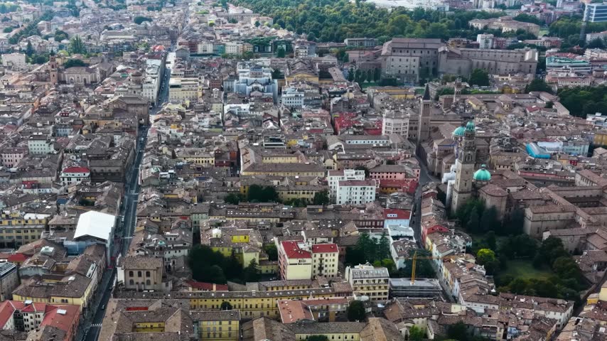 Aerial view above the old town of the city Parma in Italy, on a cloudy  day in summer.
