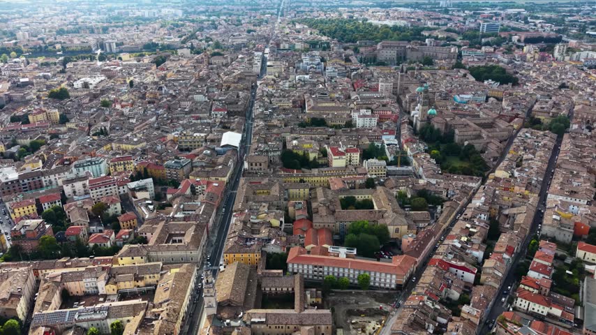 Aerial view above the old town of the city Parma in Italy, on a cloudy  day in summer.