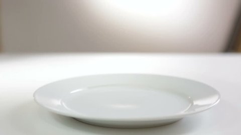 Waiter opens the empty dish