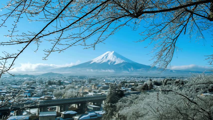 Beautiful snow capped mountain view with winter town below