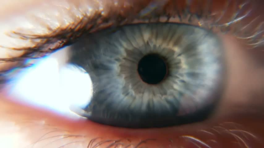 Extreme macro close-up of a human blue eye, revealing detailed iris patterns, dark pupil, eyelashes, and natural eye texture in a cinematic medical and beauty-inspired shot.