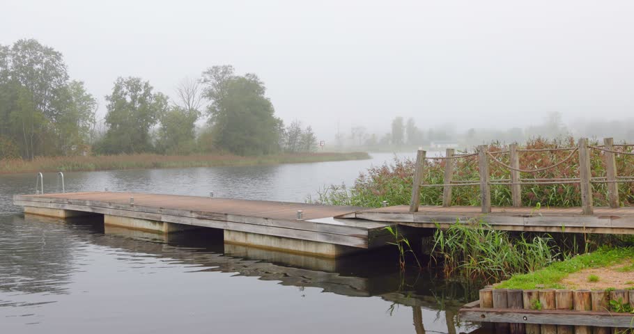 Boat dock in the early morning mist