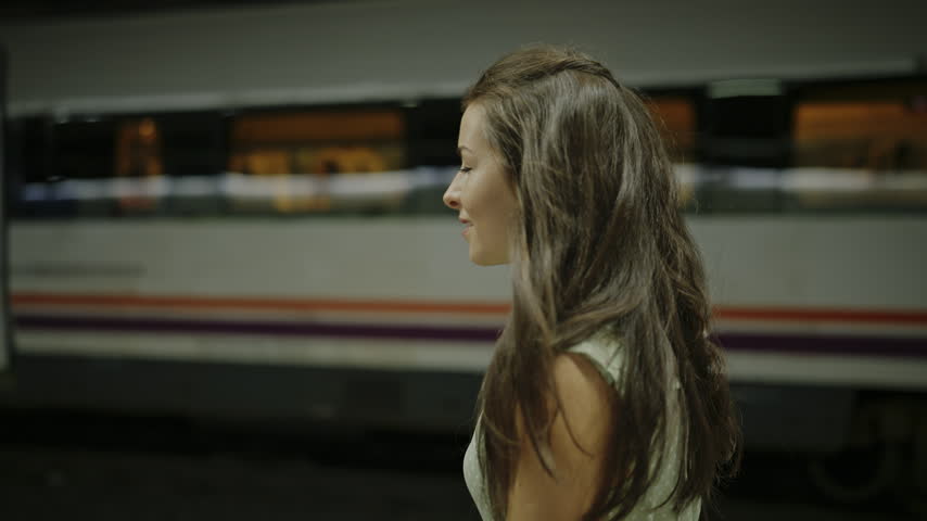 Female Tourist Walking Through Barcelona Metro Station Spain