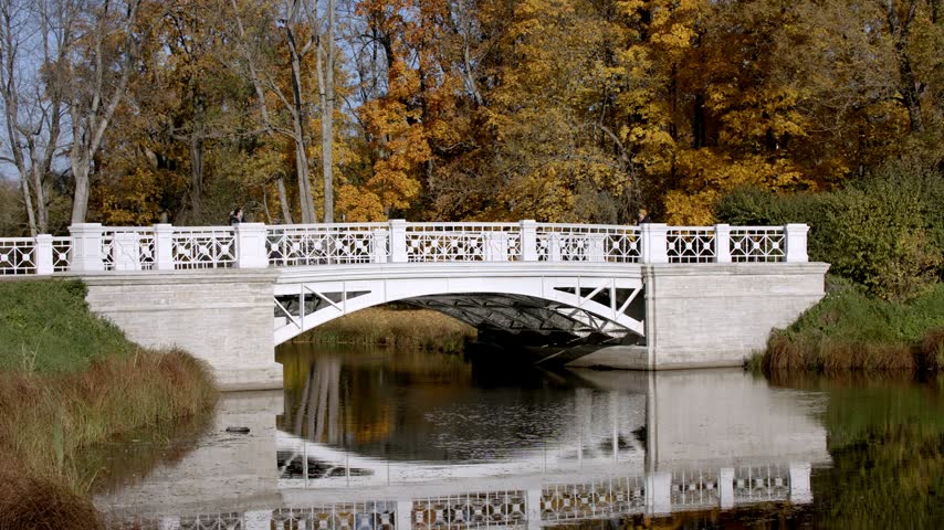 White Bridge Over Pond in Autumn Park