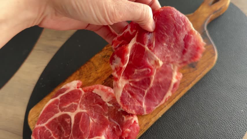 Pork raw meat tenderloin steak fresh pork serving size natural ingredients healthy eating, wholesome tasty dish, snack gourmet, rustic food background on the table top view copy space