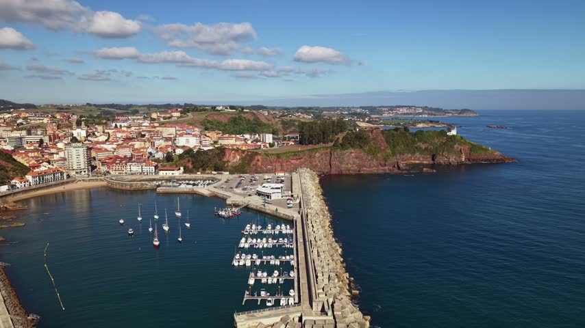 Beautiful marina bay in Candas town with moored sailboats and yachts. Asturian shoreline, Spain