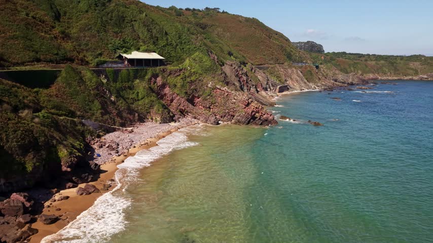 Aerial view of wild beach and turquoise Atlantic ocean near Gijon Asturias Spain. Playa de El Tranqueru 