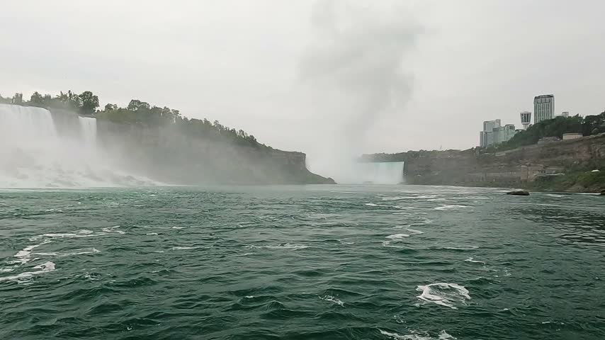 Boat Tour Approaching Niagara Falls Through Powerful Misty Waters