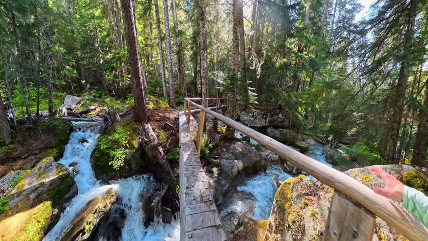 Crossing Long Bridge Over Creeks in North Cascades National Park