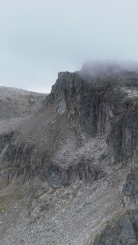 Misty Mountain Peaks and Rugged Rocky Slopes in the Vast Wilderness of British Columbia, Canada