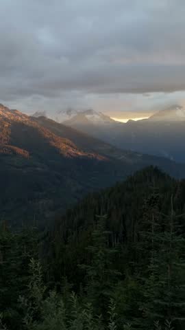 Majestic British Columbia Mountains and Evergreen Forests Bathed in Golden Sunset Light, Canada