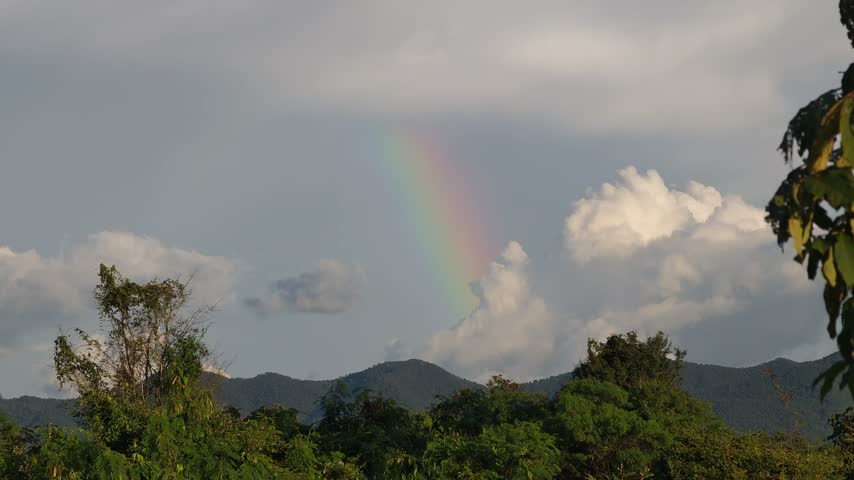 A beautiful colorful rainbow stretching across the sky