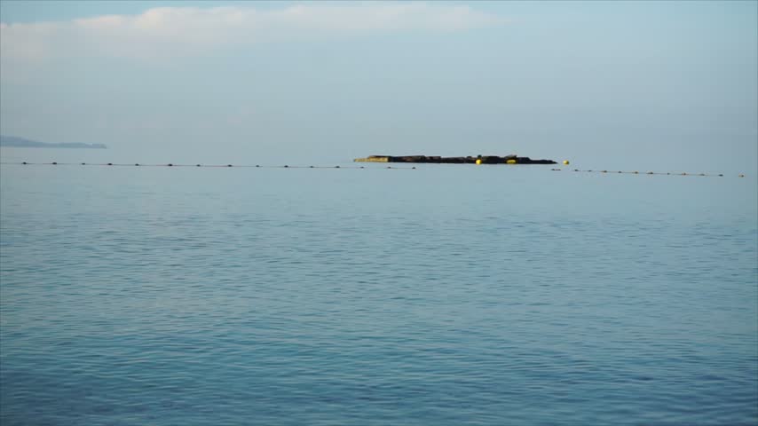 Calm morning over the open sea, with soft light creating a peaceful and serene ocean landscape.