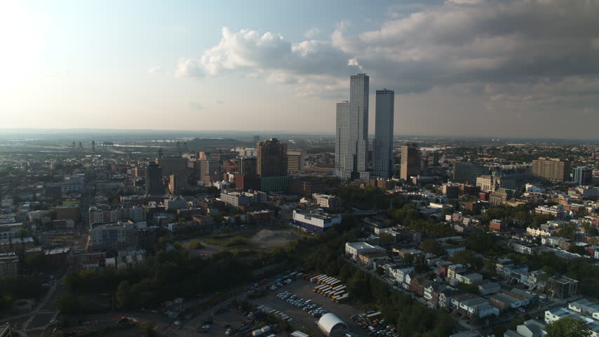 Bright daylight across Jersey City, Superb Quality, aerial view shot of Journal Square and The Heights, New Jersey, USA showing dense residential neighborhoods, urban streets and city development under clear daytime conditions, crystal clear crisp image