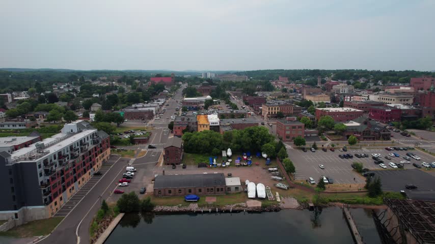 Left to Right Aerial of Marquette Michigan on an overcast summer day in the Upper Peninsula.