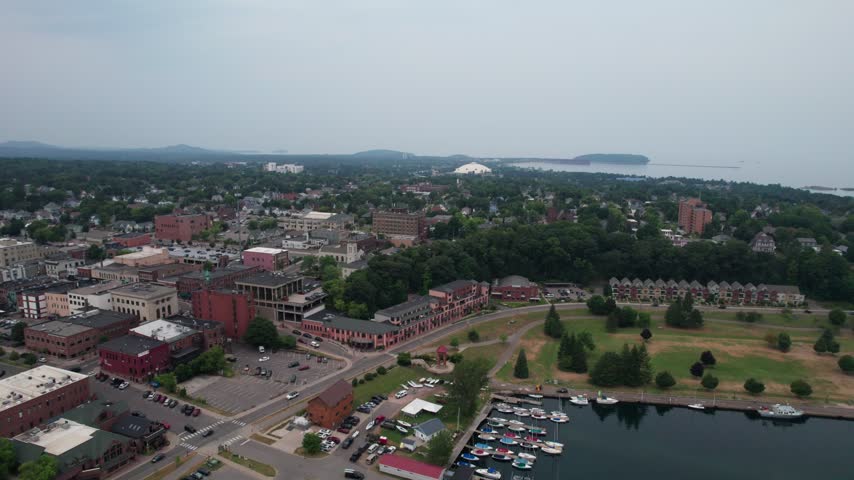 Right to left vista Aerial of Marquette Michigan on an overcast summer day in the Upper Peninsula.
