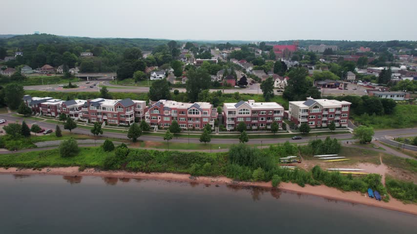 Right to Left Aerial of Marquette Michigan on an overcast summer day in the Upper Peninsula.
