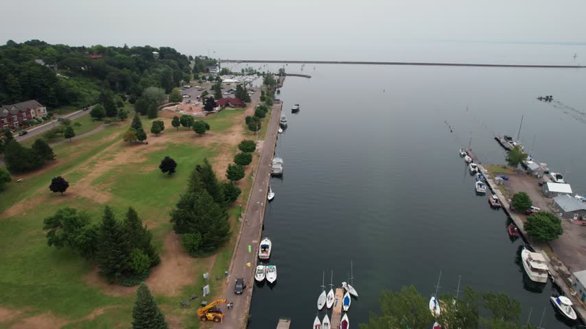 Turning aerial of Marquette Michigan on an overcast summer day in the Upper Peninsula.