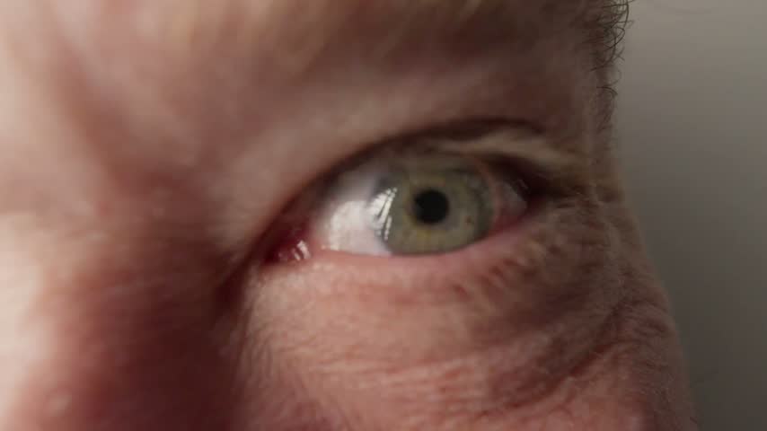 macro of man blue eye moving 
