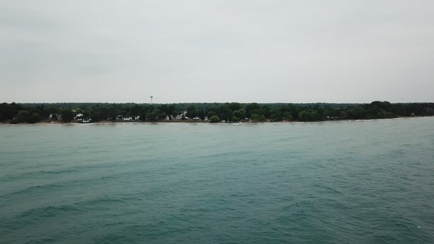 Wide landscape of a large body of water with a distant shoreline, United States