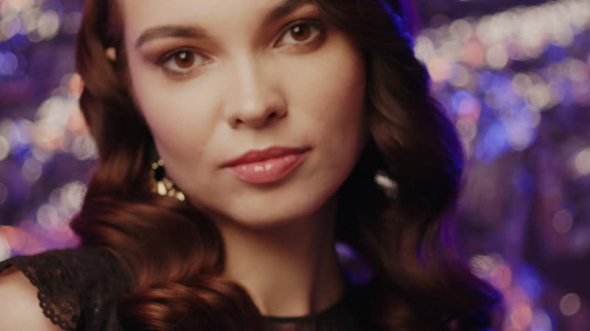 An Elegant Portrait Depicting a Woman with a Stunning and Glamorous Hairstyle in Detail