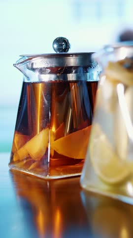 Fruit tea in a teapot. herbal tea. tea drink. close-up. three glass teapots with different fruit and herbal, colorful, homemade teas.