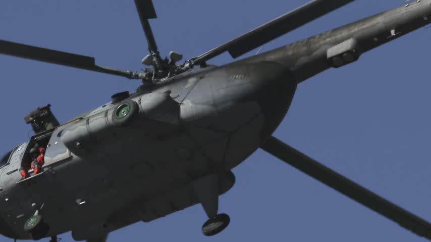 
Mil Mi-17 transport helicopter of the Czech Armed Forces flying across a blue sky