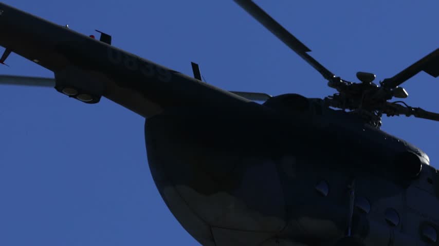 
Mil Mi-17 transport helicopter of the Czech Armed Forces flying across a blue sky
