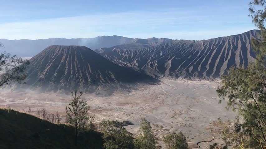 Stunning view of Mount Bromo in Bromo Tengger Semeru National Park, East Java, Indonesia, showcasing a dramatic volcanic landscape surrounded by mountains and scenic natural scenery.