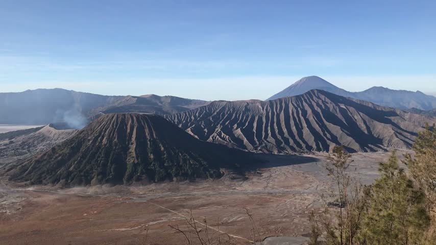 Stunning view of Mount Bromo in Bromo Tengger Semeru National Park, East Java, Indonesia, showcasing a dramatic volcanic landscape surrounded by mountains and scenic natural scenery.