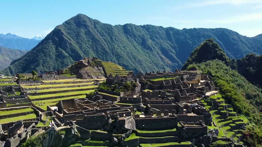 Panoramic aerial view of the famous lost city of machu picchu. Majestic incan ruins and agricultural terraces surrounded by the andes mountains