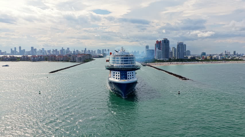 Miami tour 4k footage. Cruise ship voyage. Aerial view of cruise in summer vacation. Cruise ship tour and travel at sea. Aerial view of luxury liner voyage. Ship leaving Miami beach port