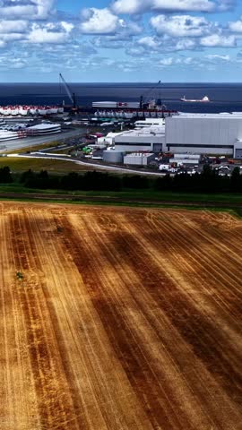 Siemens Gamesa Renewable Energy plant in Cuxhaven, Germany, with coastal surroundings and industrial buildings visible