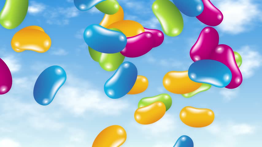 Vibrant multi-colored jelly beans fall through a sunny blue sky with soft white clouds.