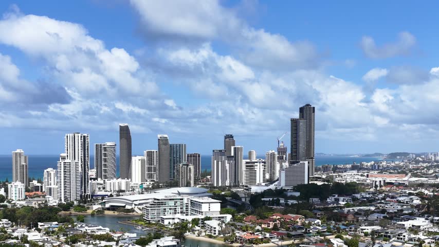 Aerial panoramic view of Surfers Paradise skyline, waterways, and residential coast in Gold Coast, Australia.