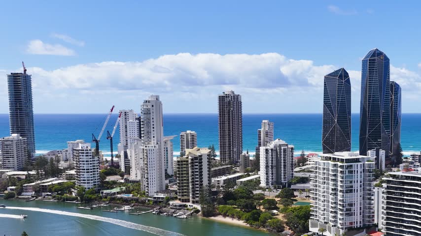 Aerial panoramic view of Surfers Paradise skyscrapers along the coastline in Gold Coast, Australia.