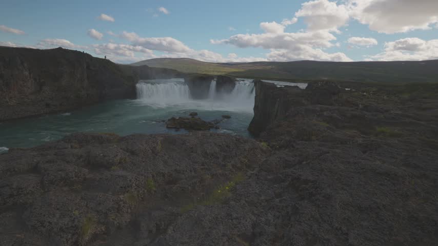 Panoramic Wide View of Godafoss Waterfall Cascading Into River Basin in North Iceland Landscape