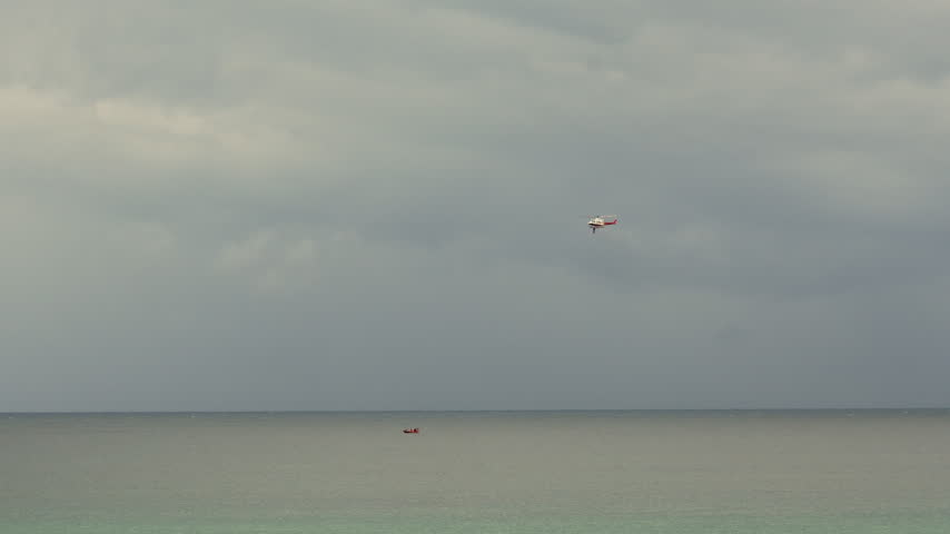Rescue helicopter and boat during a maritime drill in Santander Spain