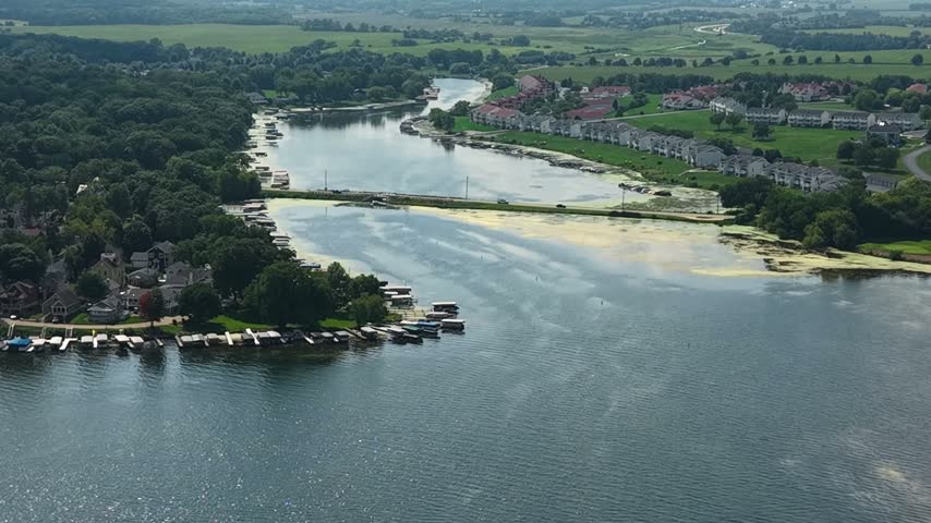 Drone View of Bridge Traffic on Delavan Lake Bay, Wisconsin USA on Sunny Summer Day