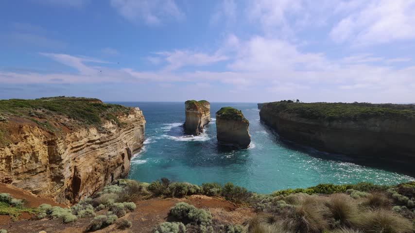 Panoramic view of Tom and Eva limestone rock stacks off Loch Ard Gorge on the Great Ocean Road coast Victoria Australia, Twelve Apostles National Park