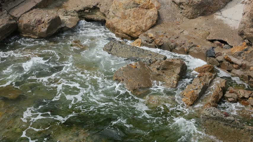 Waves are washing against the shore.
