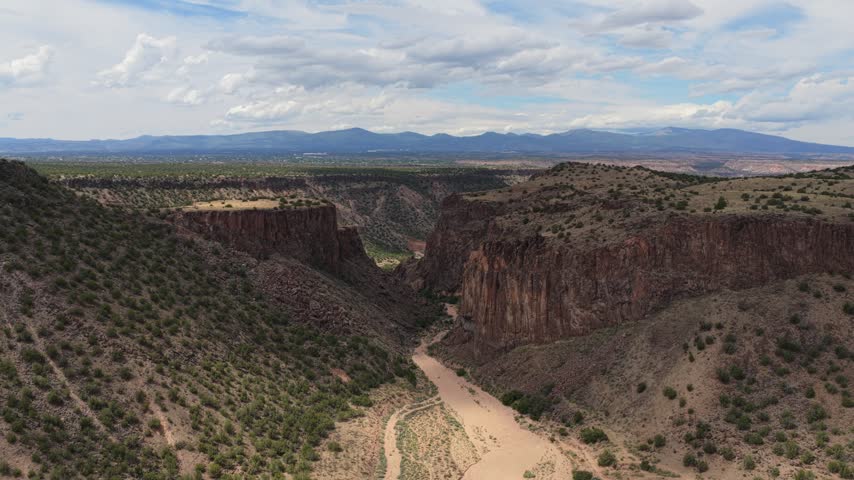 Aerial view of the rugged cliffs and dry riverbed of Diablo Canyon Recreation Area in Santa Fe, New Mexico, United States.