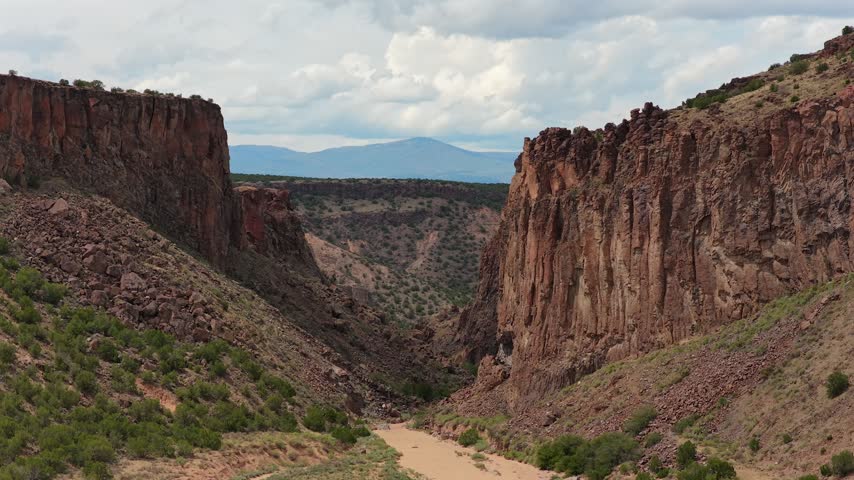 Aerial view of the rugged red rock cliffs and desert landscape of Diablo Canyon Recreation Area in Santa Fe, New Mexico, United States.