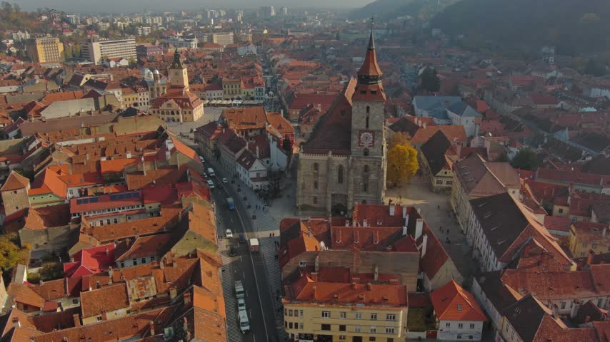 Aerial view of the Black Church and historic rooftops in the old town of Brasov, Brasov, Romania.