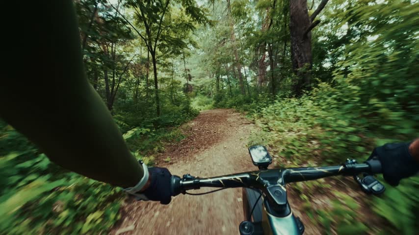 Mountain Biker Riding Gravel Bike On Forest Trail Passing Signpost During Outdoor Adventure And Cycling Journey. Sport Concept Highlighting Active Lifestyle And Cycling. Trail Scene Showing Bike Riding. Our Mountain Biking Delivers Athletic Performance. Every Cycling Moment Ensures Outdoor Exploration. Each Sport Process Guarantees Healthy Fitness