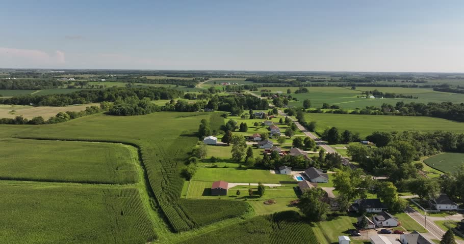 Aerial view of rural landscape with cornfields and residential houses in South Vienna, Ohio, United States.